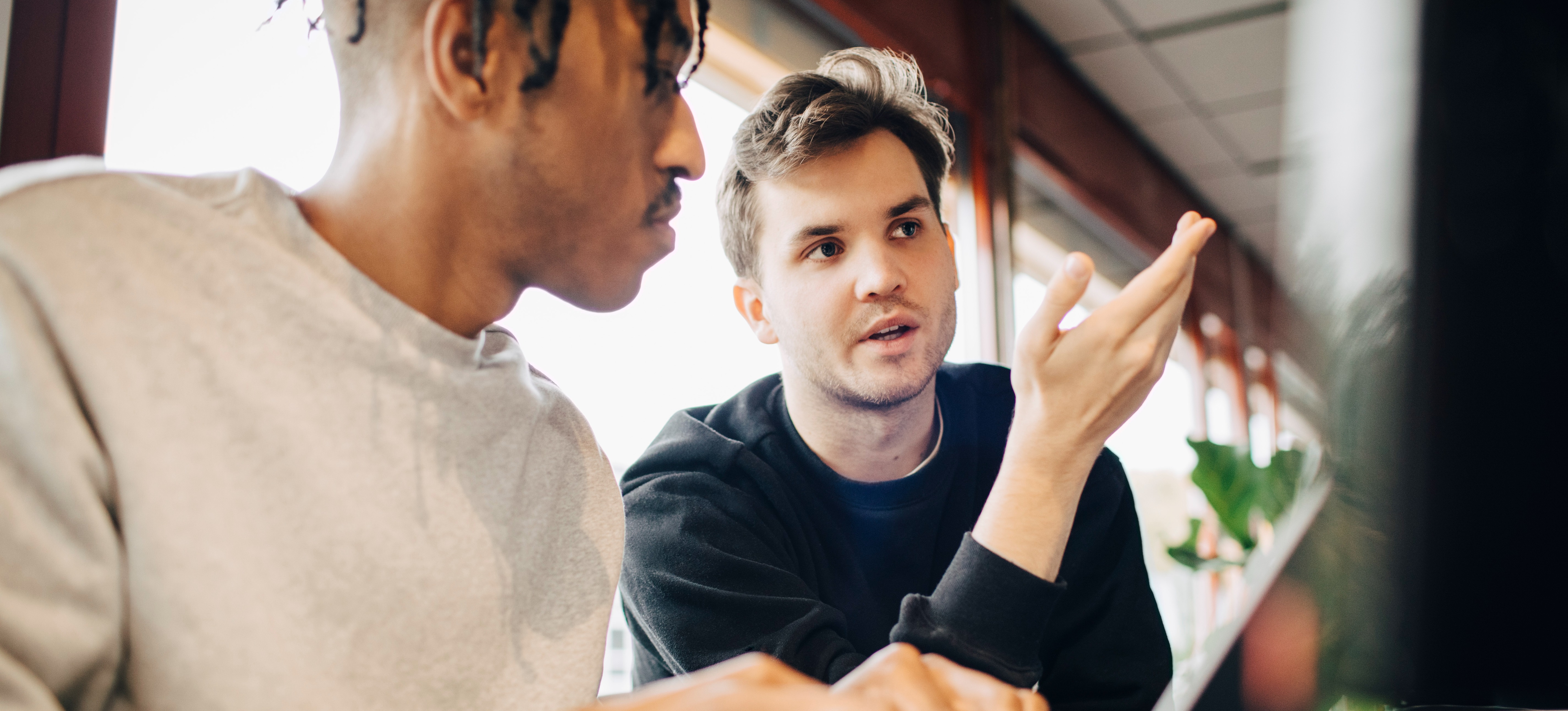 [Feature Image] Two aspiring developers discuss software engineer degree pathways as they plan their educations. 
