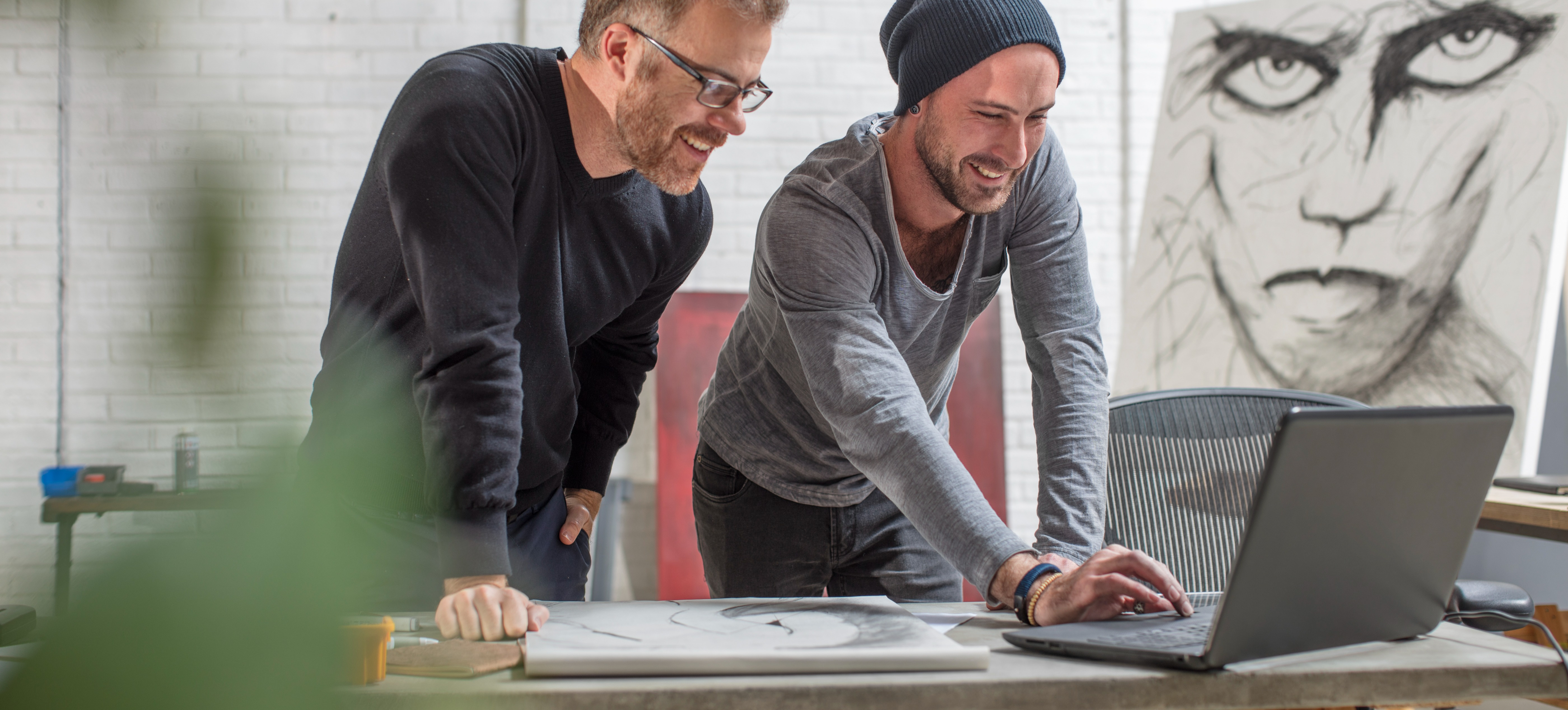 [Featured image] A professional showing their coworker concept art generated on DALL-E.