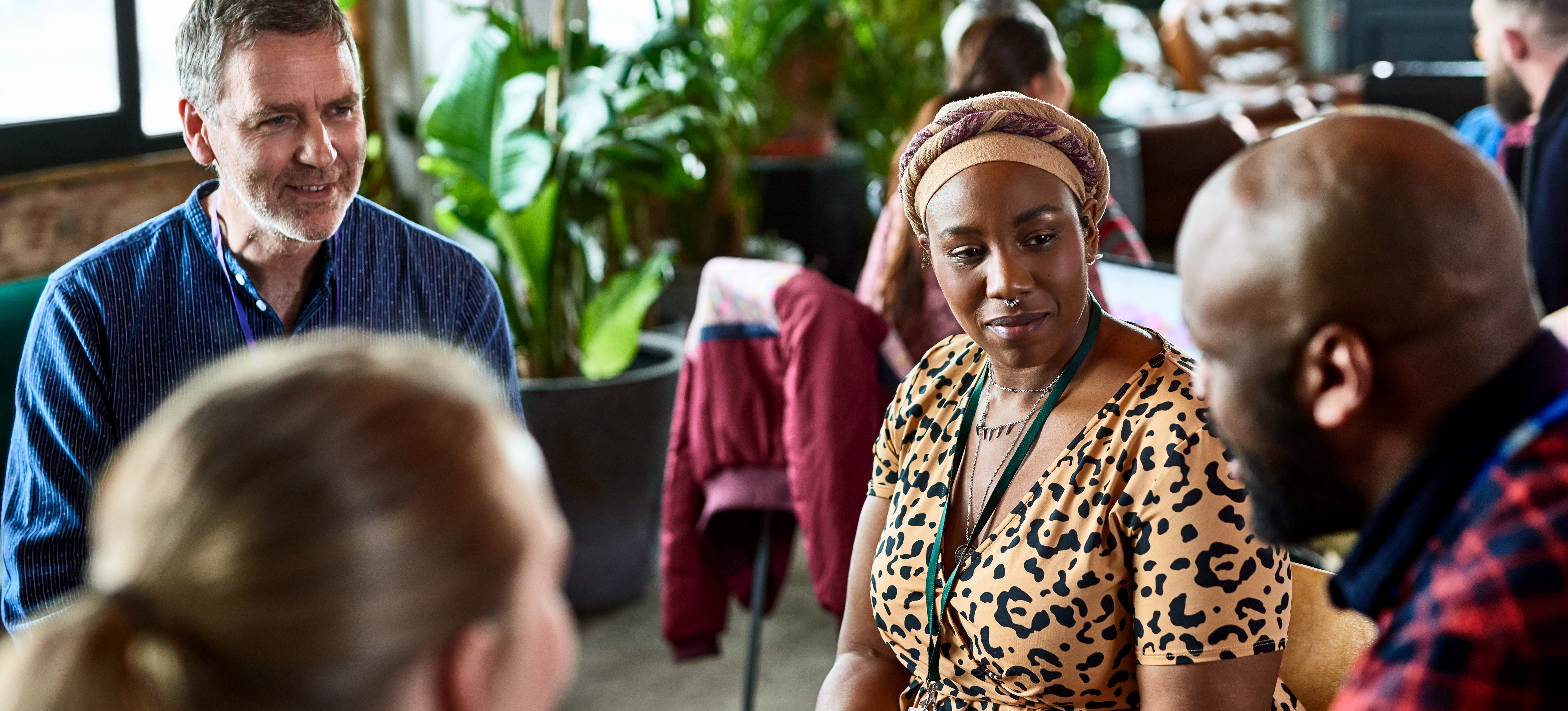 [Featured Text]: A group of diverse people collaborate, demonstrating a valuable skill needed for many sociology degree jobs.
