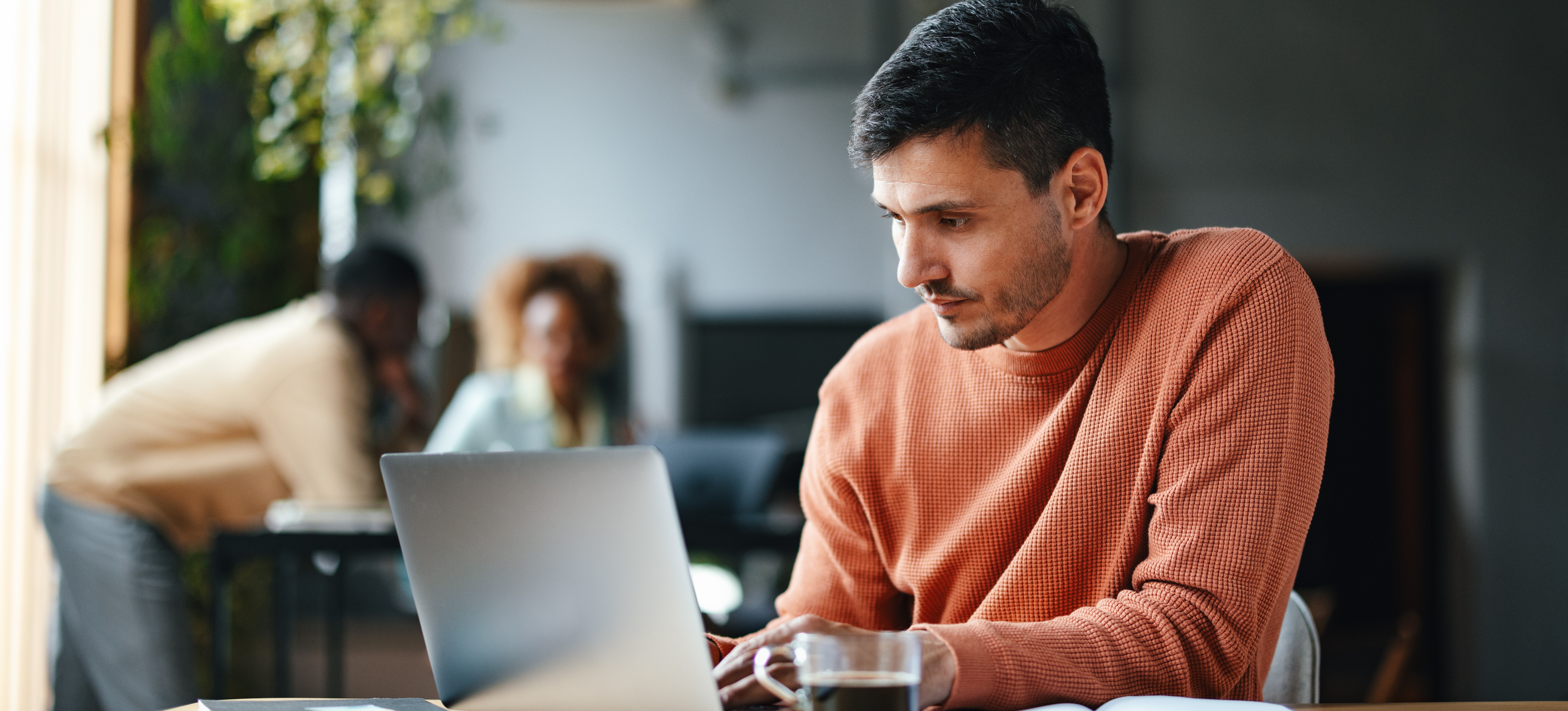 [Feature Image] A learner researches how to create a study guide on a laptop as they plan for their new course.
