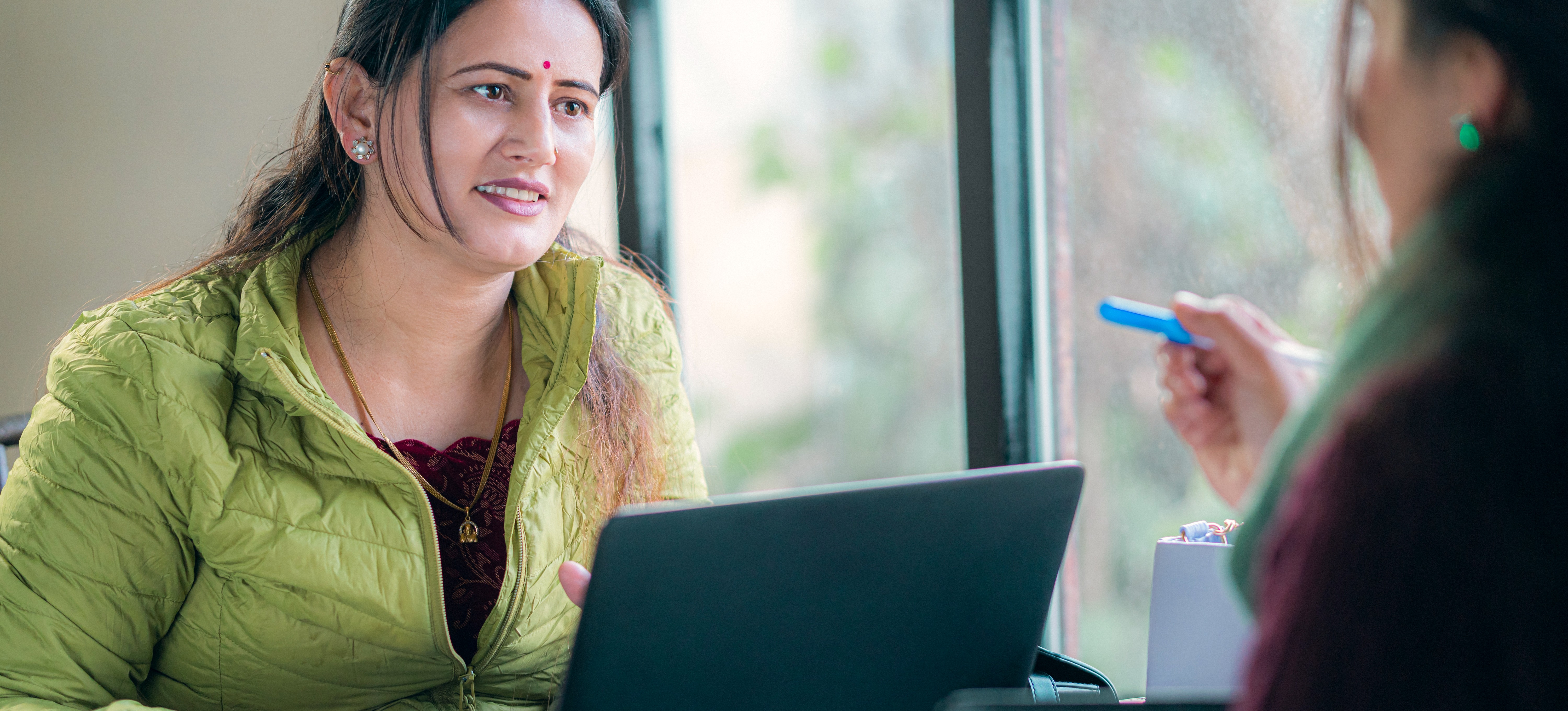 [Featured Image] A DevOps engineer answers interview questions in an office setting.
