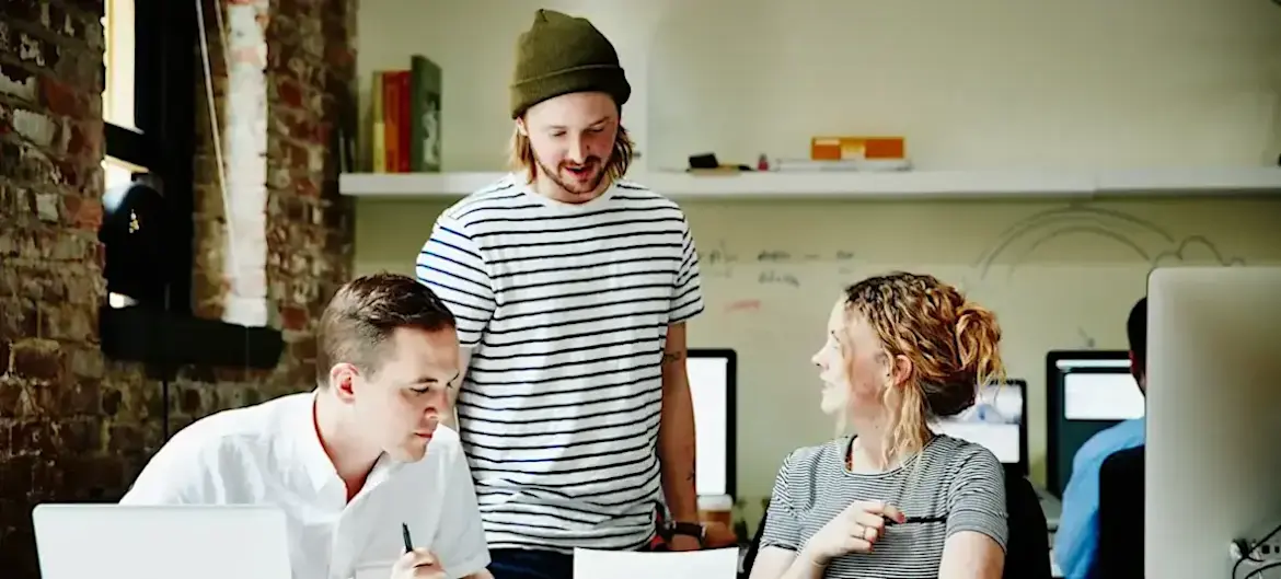 [Feature Image] Three learners debate “What is a transformer model” as they study for a course in which they’re learning about its use.
