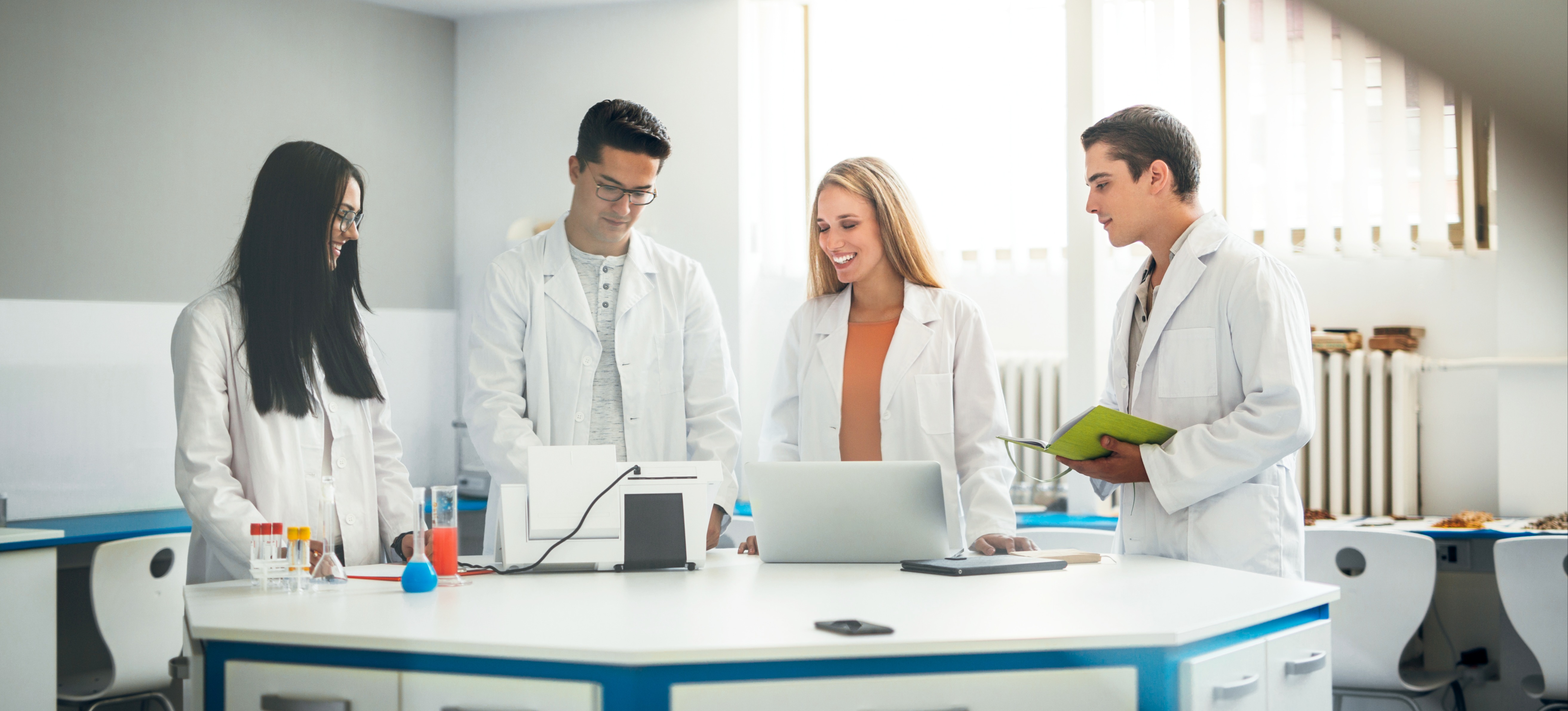 [Featured Image] Environmental scientists in their lab use scikit-learn to apply data-driven methodologies in their research for insights and discoveries.