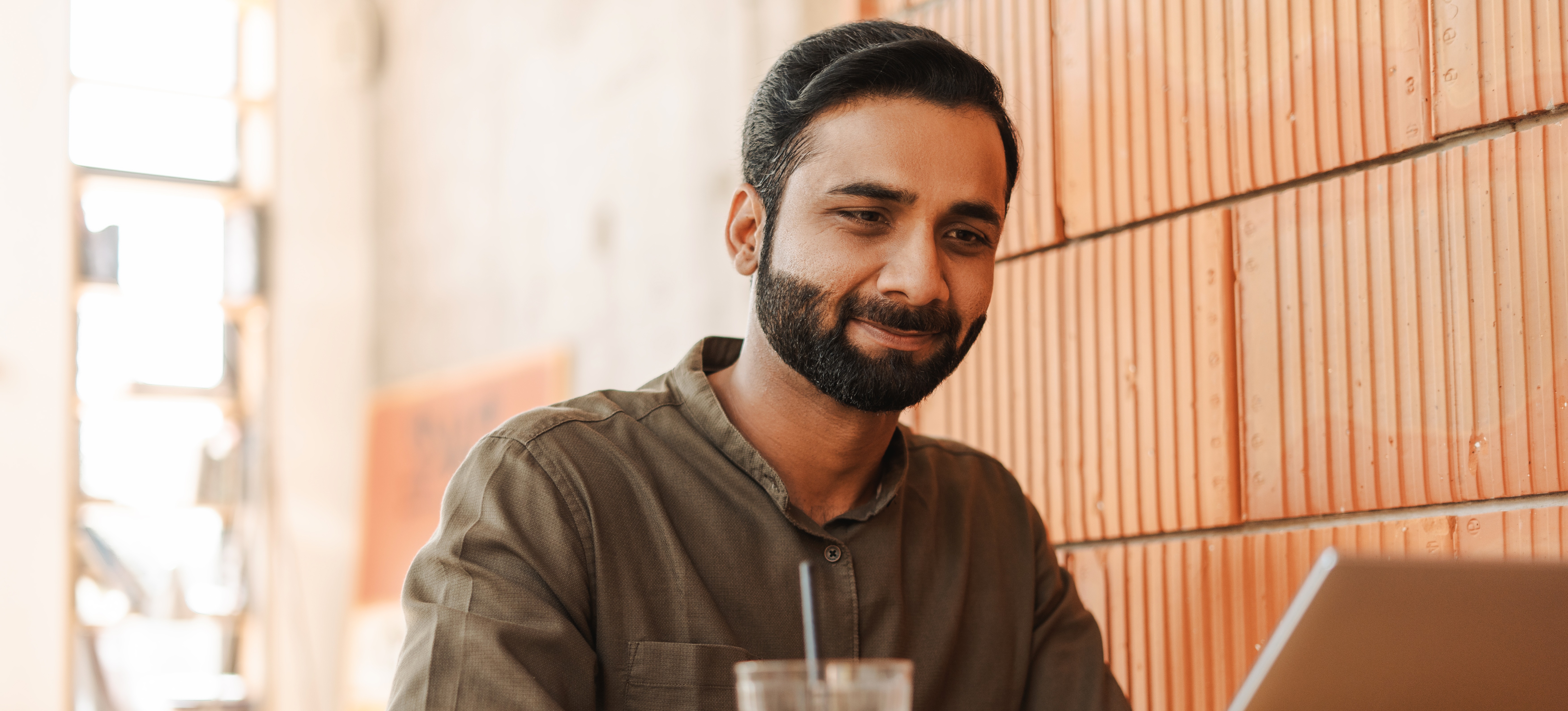 [Featured Image] A tech professional sits at a laptop, preparing for Linux certification.
