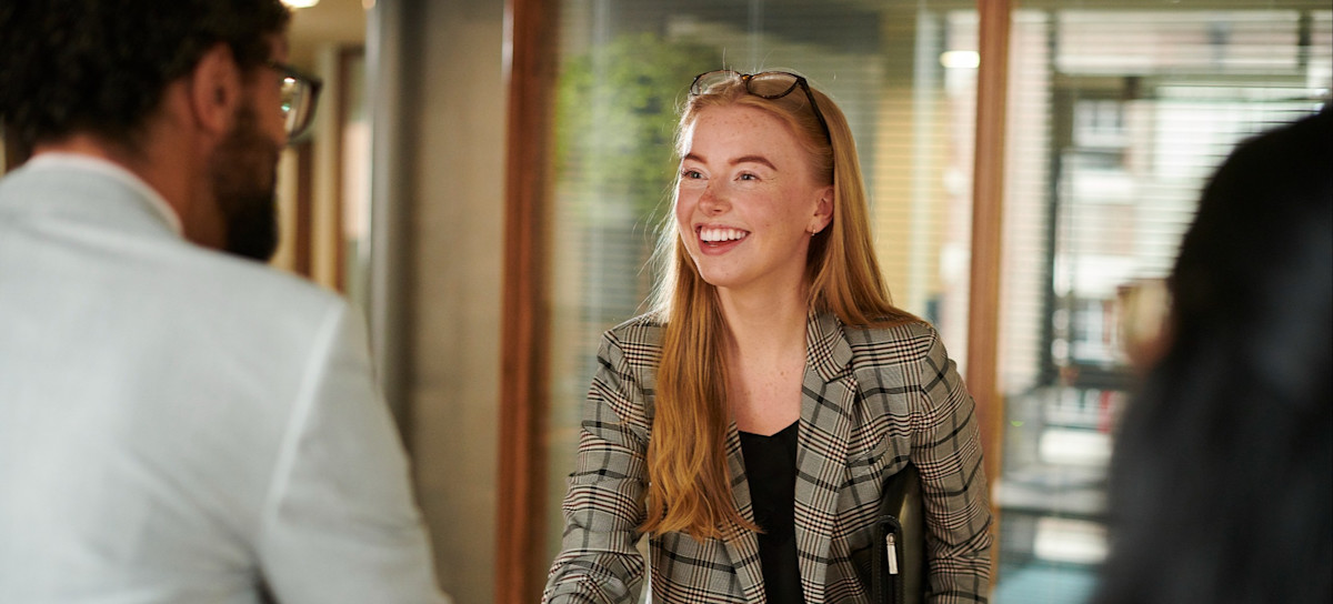[Featured image] Two people shake hands before beginning a job interview.
