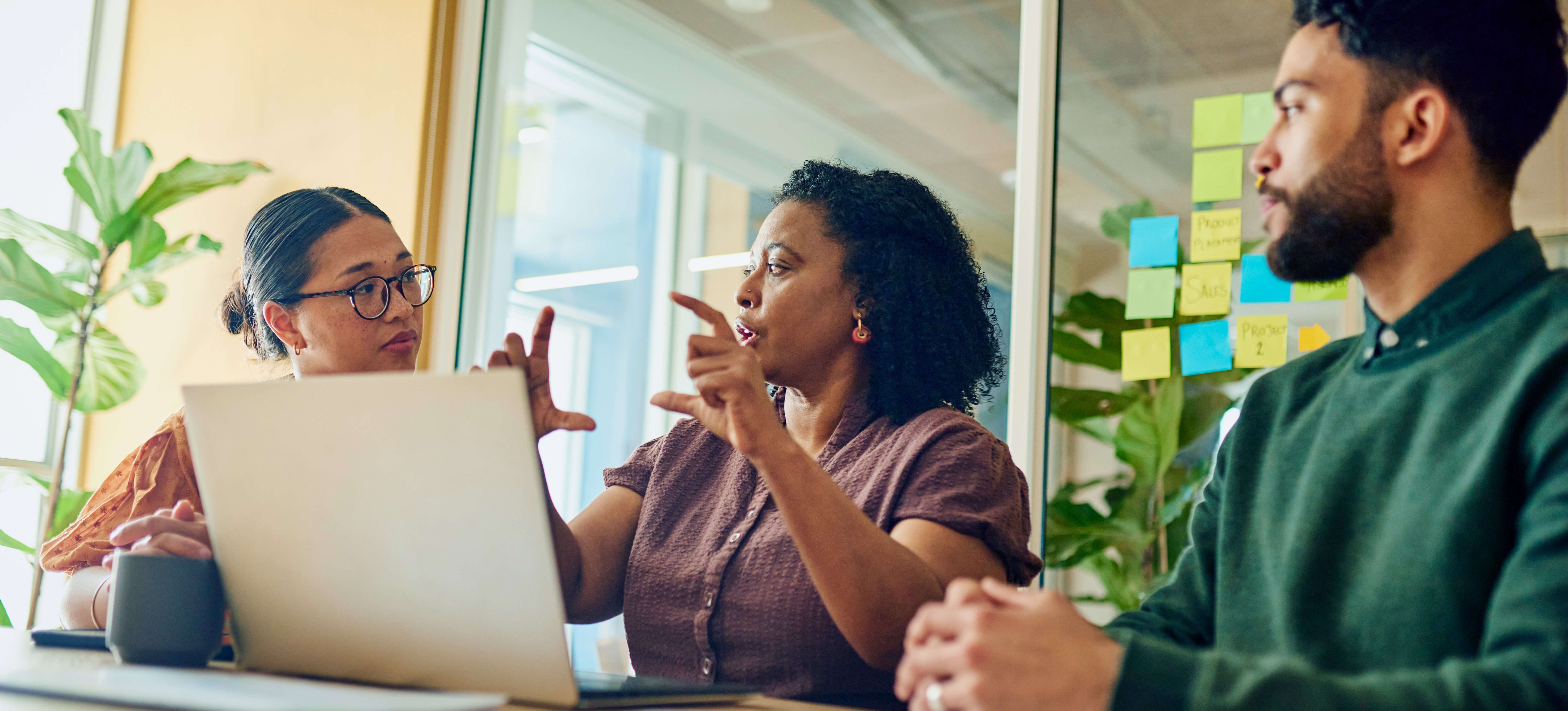 [Feature Image] A trio of marketing professionals meet to study for the marketing certifications they’re pursuing. 
