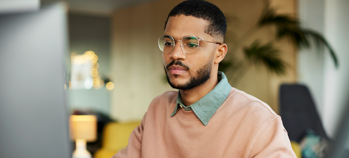 [Featured Image] A college students uses a computer to learn the benefits of having a CGEIT