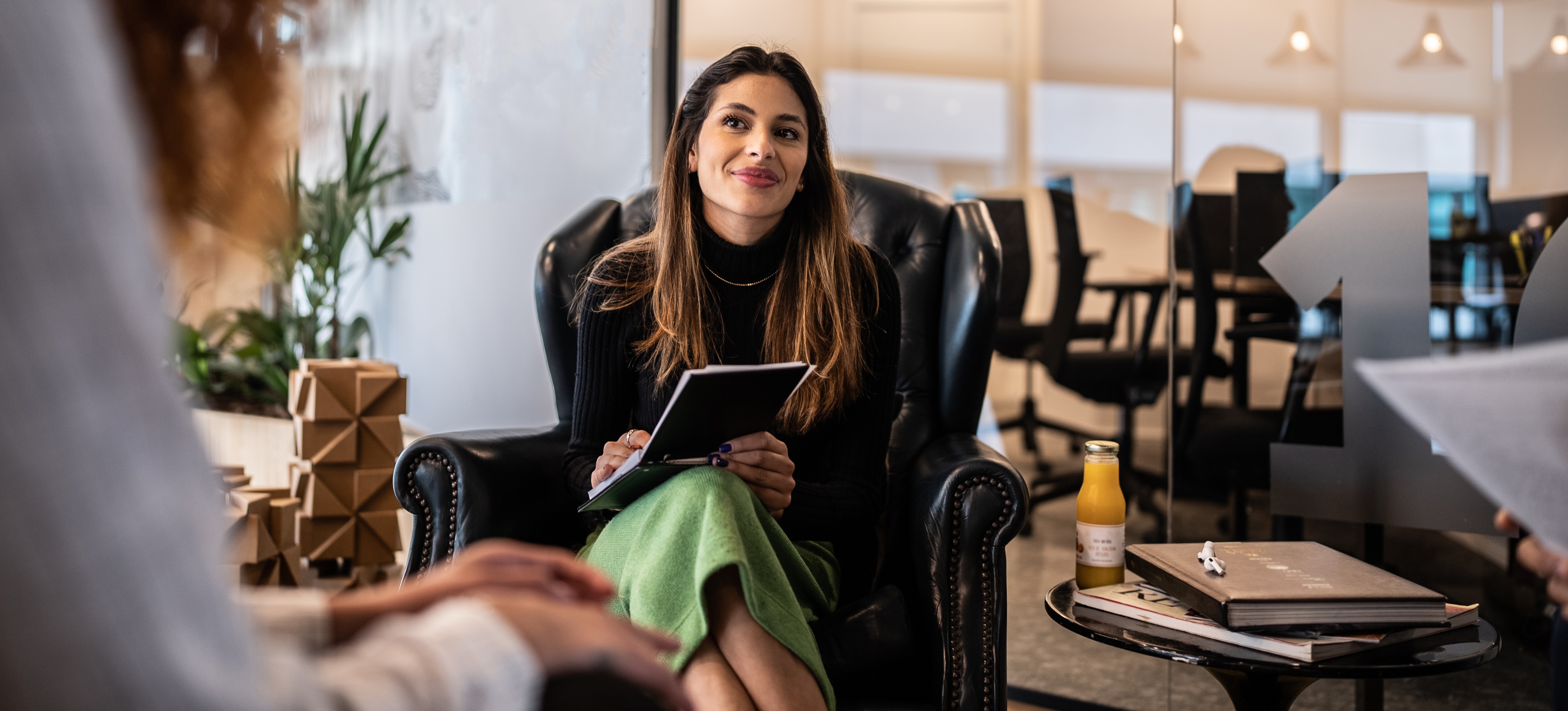 [Featured Image] A professional asking a job candidate recruiter interview questions during an interview for a recruiting role.
