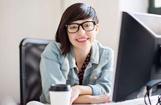 [Featured image] Woman working at computer terminal