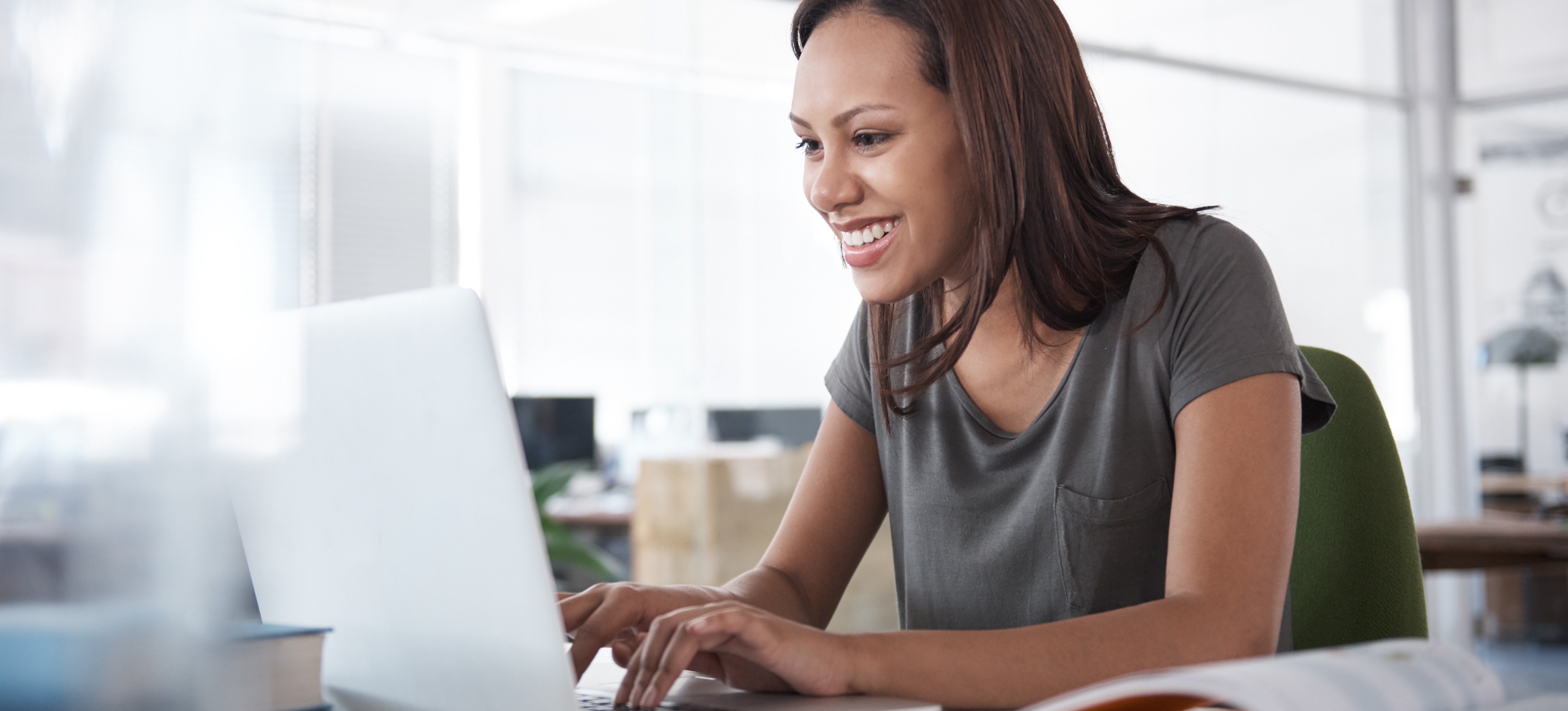 [Featured Image] A data scientist uses PyTorch on their laptop in their office. 