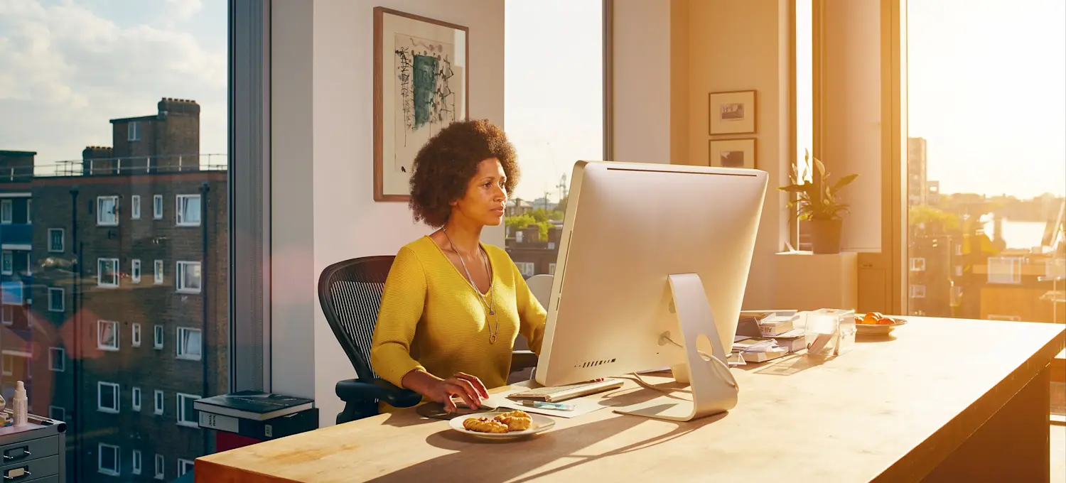 [Featured Image] A network architect works on a computer, helping design data communications networks for their organization.