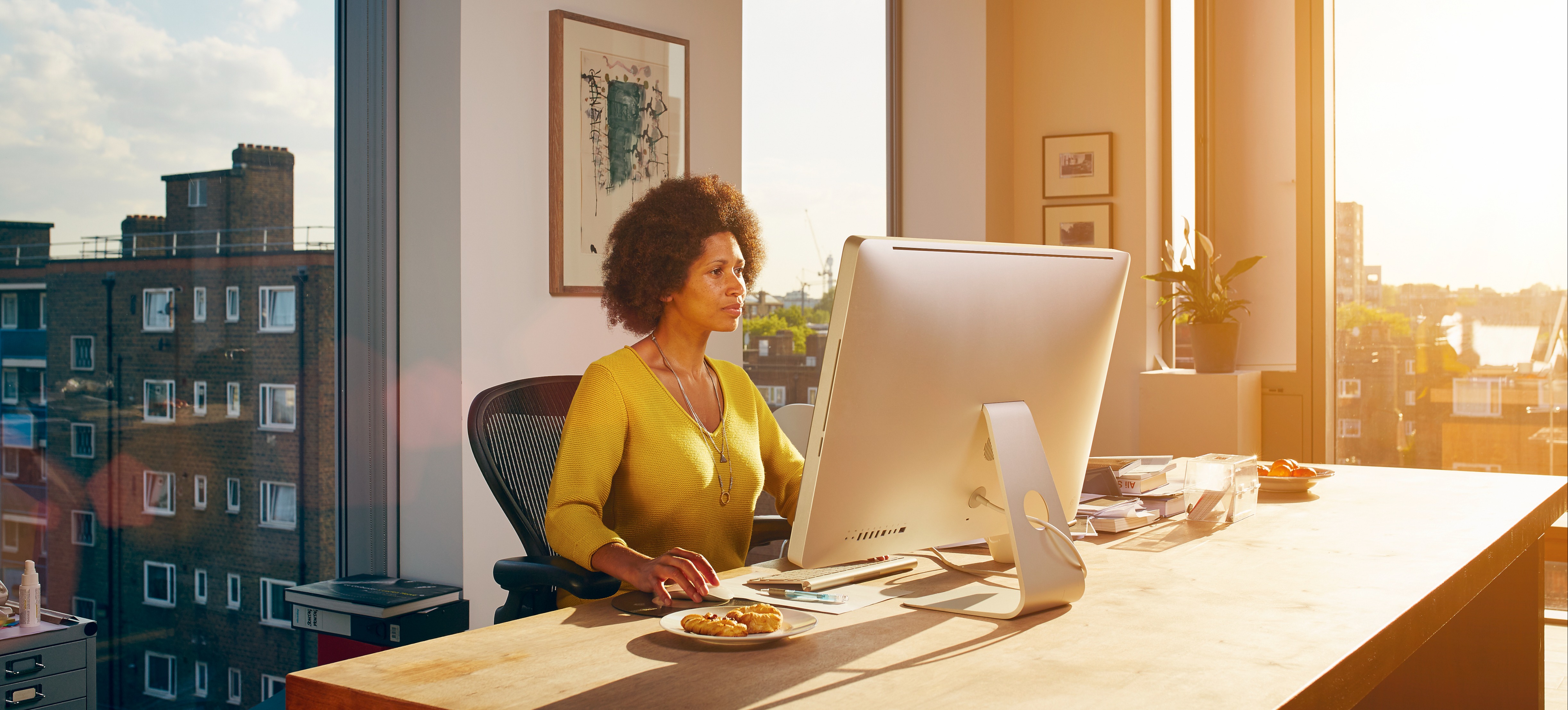 [Featured Image] A network architect works on a computer, helping design data communications networks for their organization.