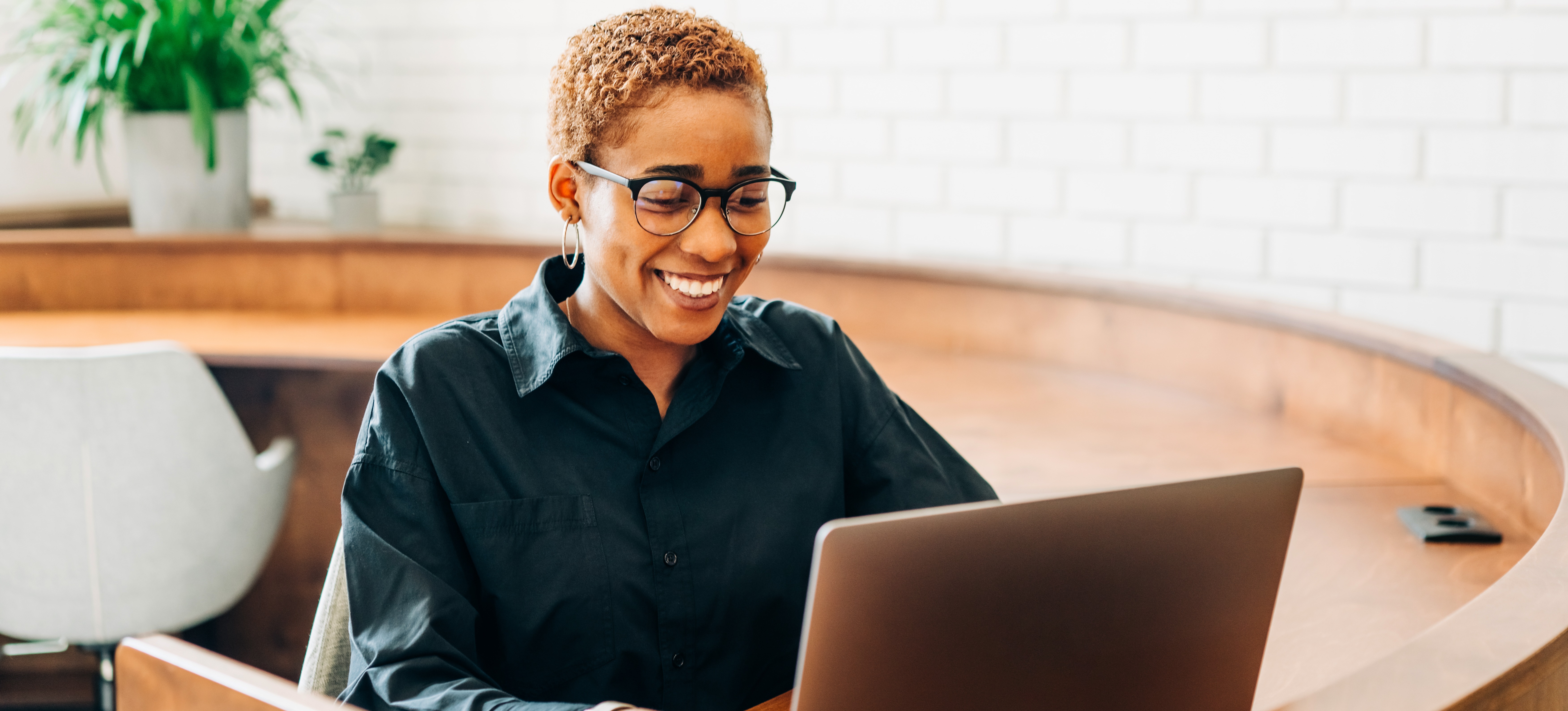 [Featured Image]: A person uses a laptop in their work as an email marketing specialist, demonstrating one of various email marketing roles.
