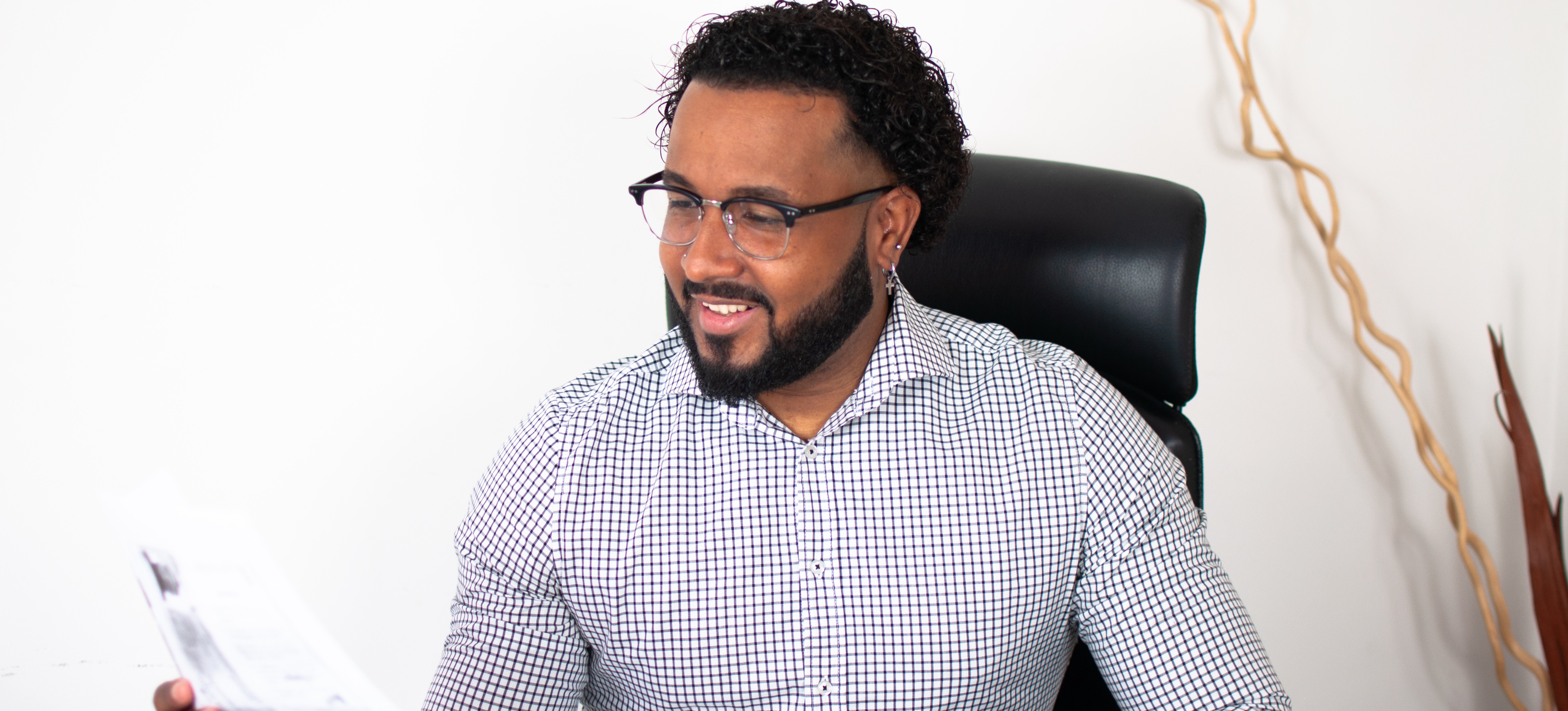 [Featured Image] A business analyst sits in his office and uses cross filter direction Power BI on a project. 
