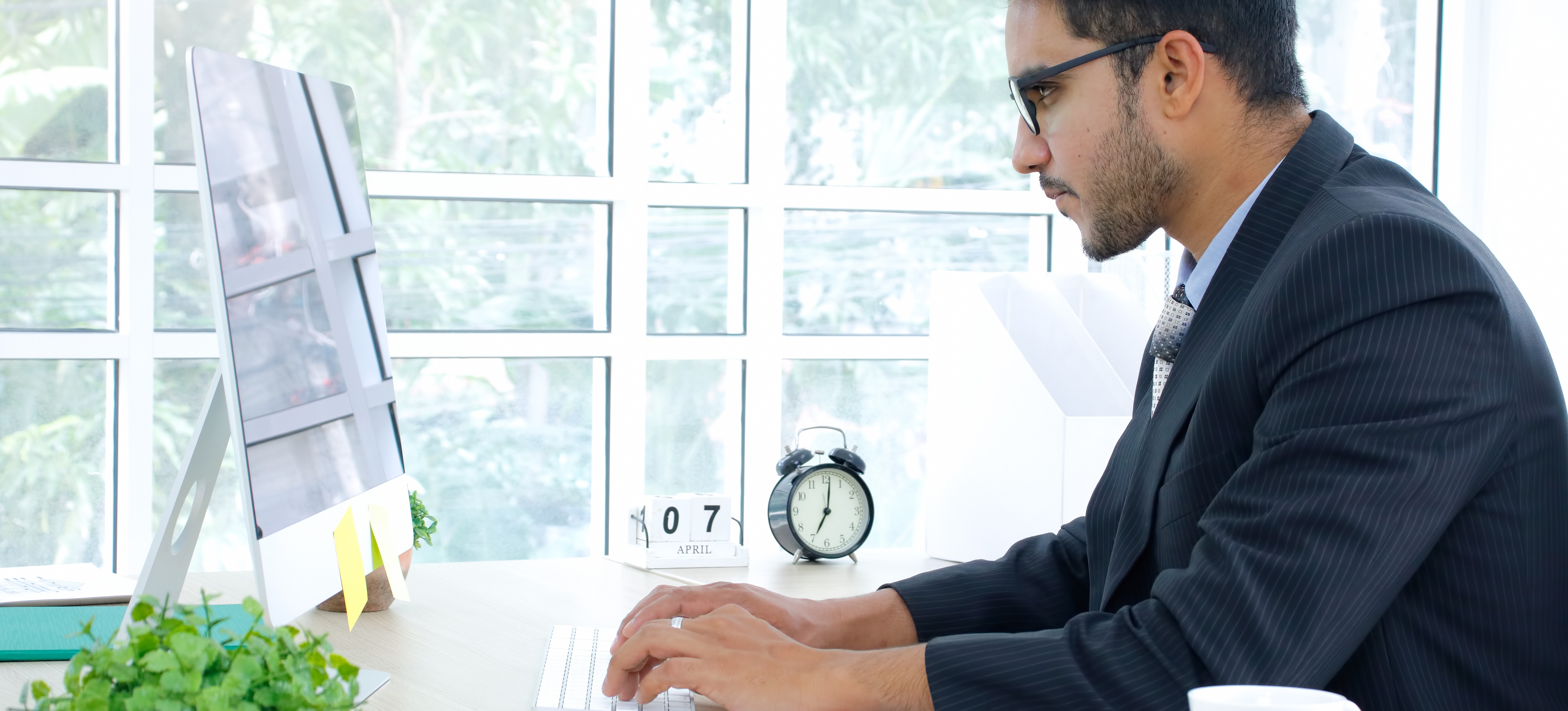 [Featured Image] A marketing professional researches the qualifications necessary to enter a master’s in marketing programme to advance their career.