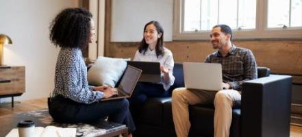 [Featured image] A team in a meeting discussing organizational plans