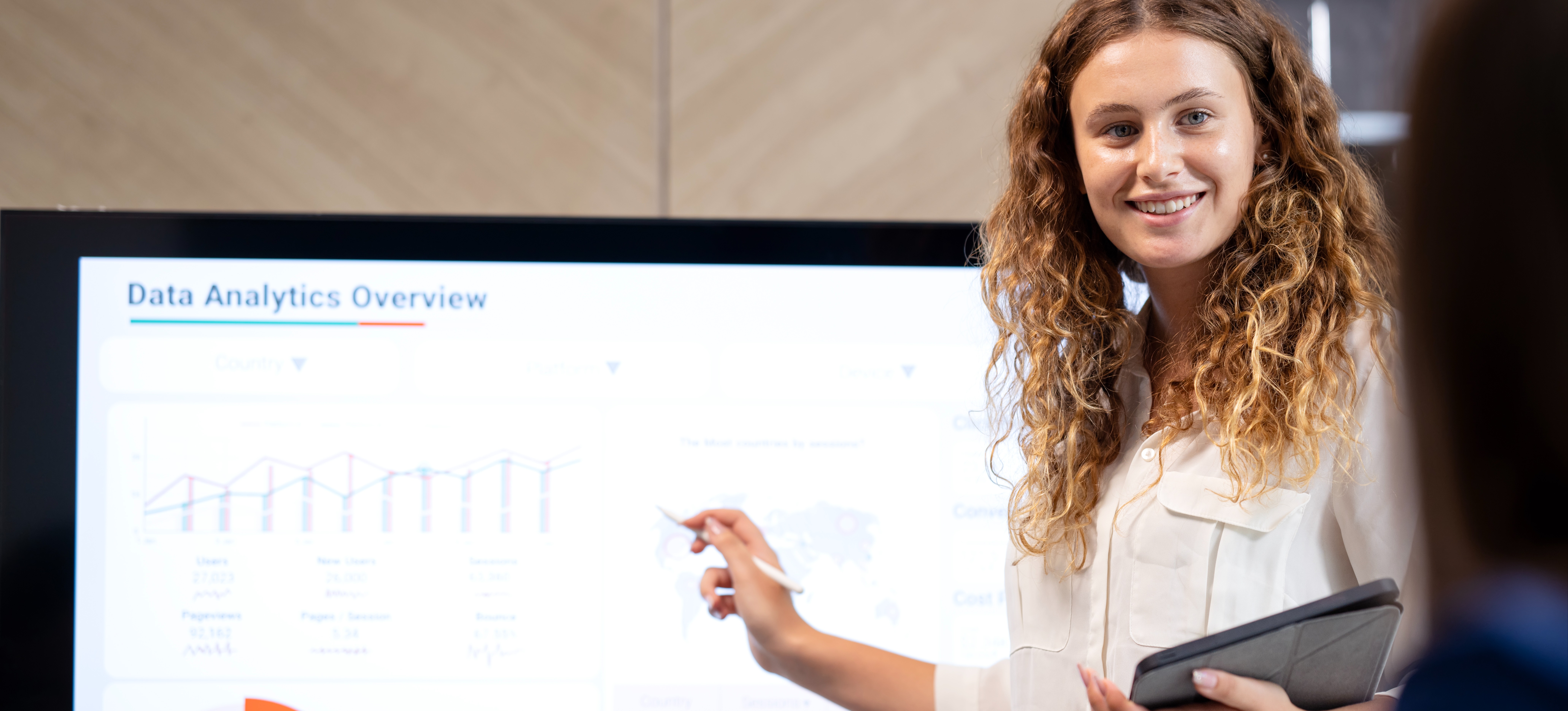 [Featured Image] A young businesswoman, who knows python, is giving a data analytics presentation of the business plans and strategies to improve feedback and customer experience.