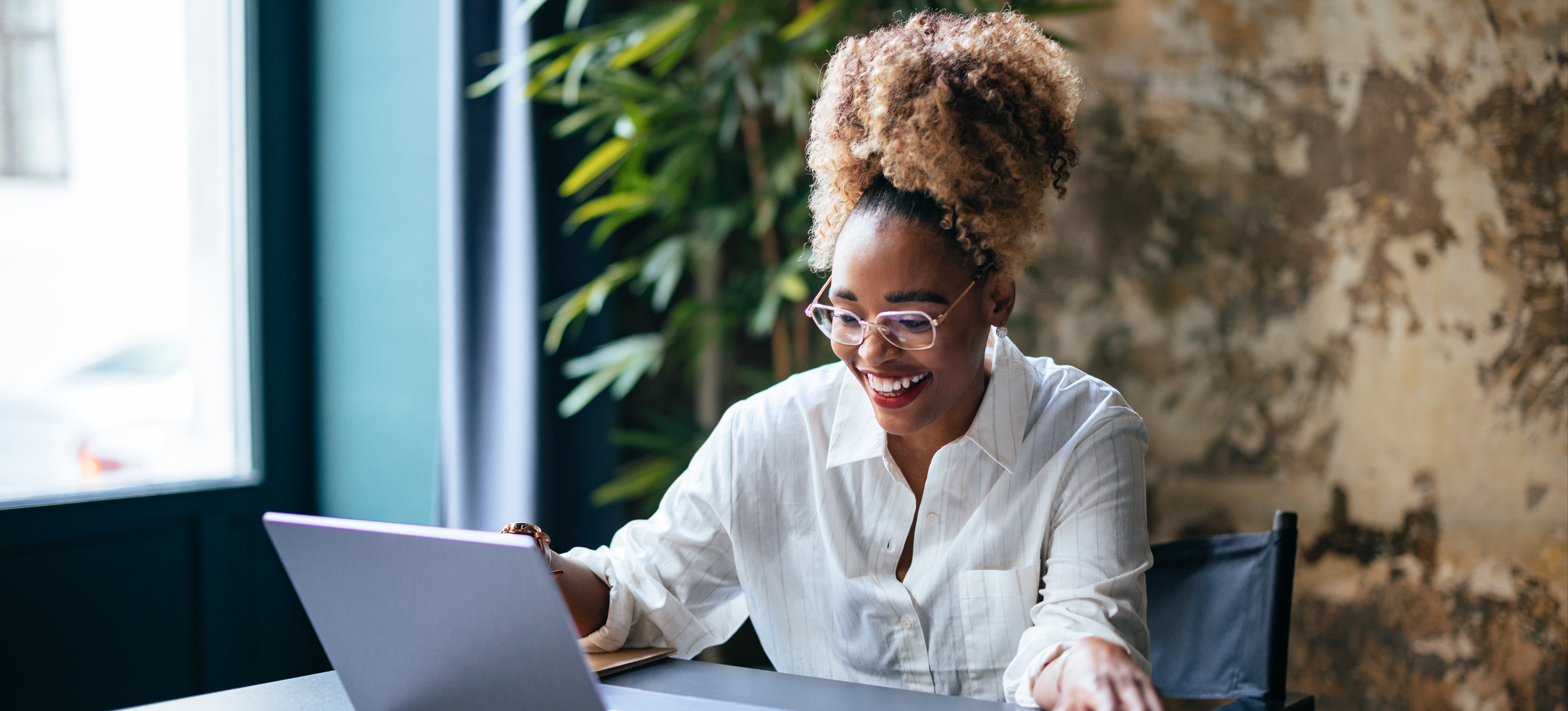 [Featured Image] A former teacher works in a new role as a project manager.
