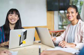 [Featured image] An IT support specialist candidate is interviewed in a panel setting.