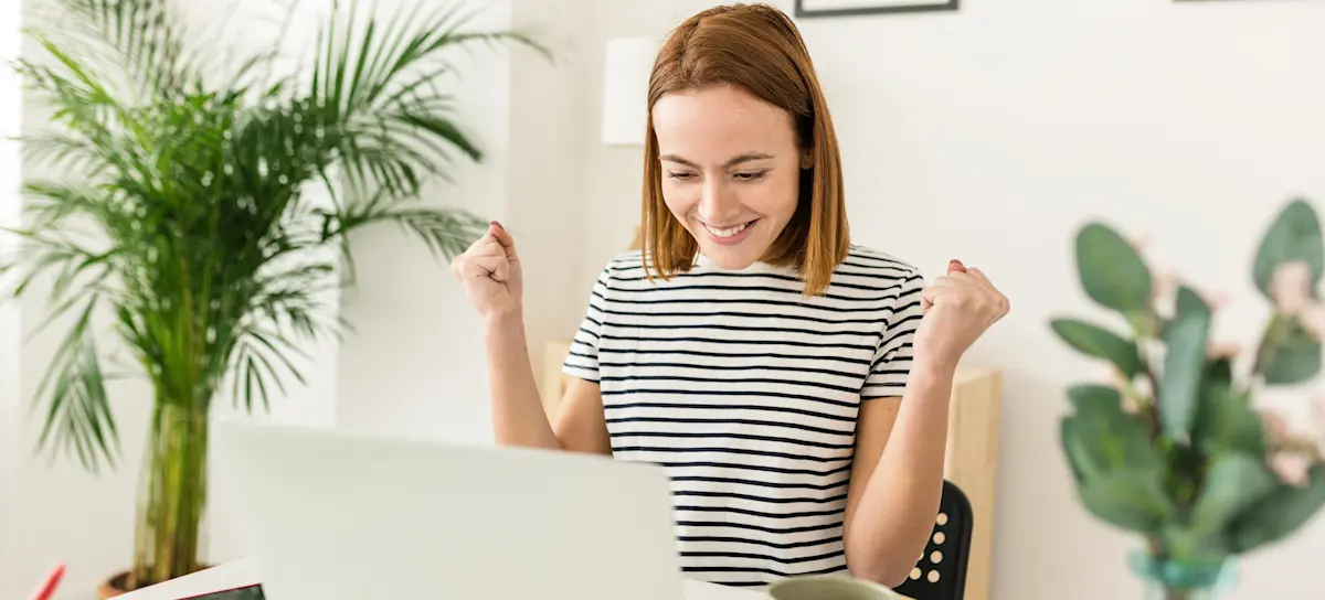 [Featured Image] An aspiring professional smiles as they research “What is a career cluster” and find their professional path. 