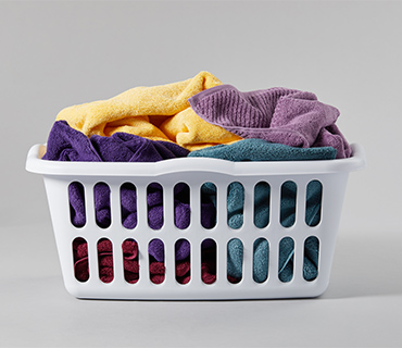 Colorful towels in a laundry basket