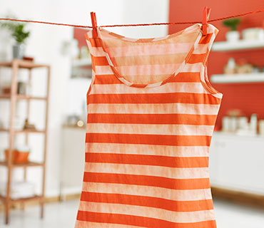 Dirty, striped top hang drying