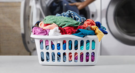 A laundry basket full of colorful garments