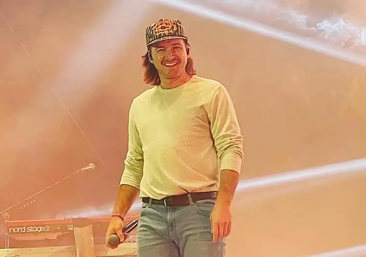 Morgan Wallen smiling on stage