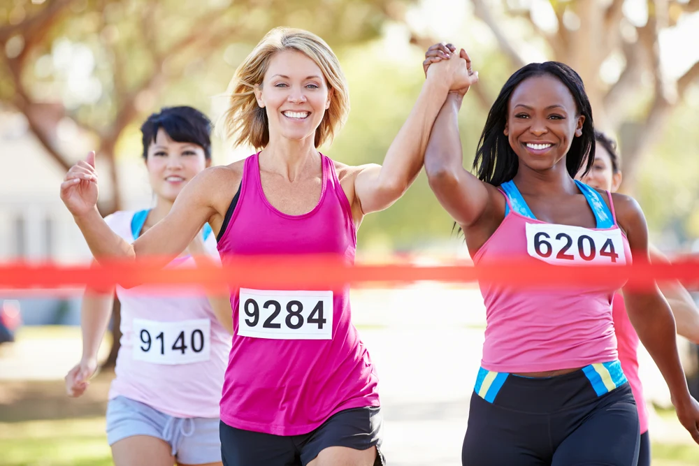 two female runners finishing race together