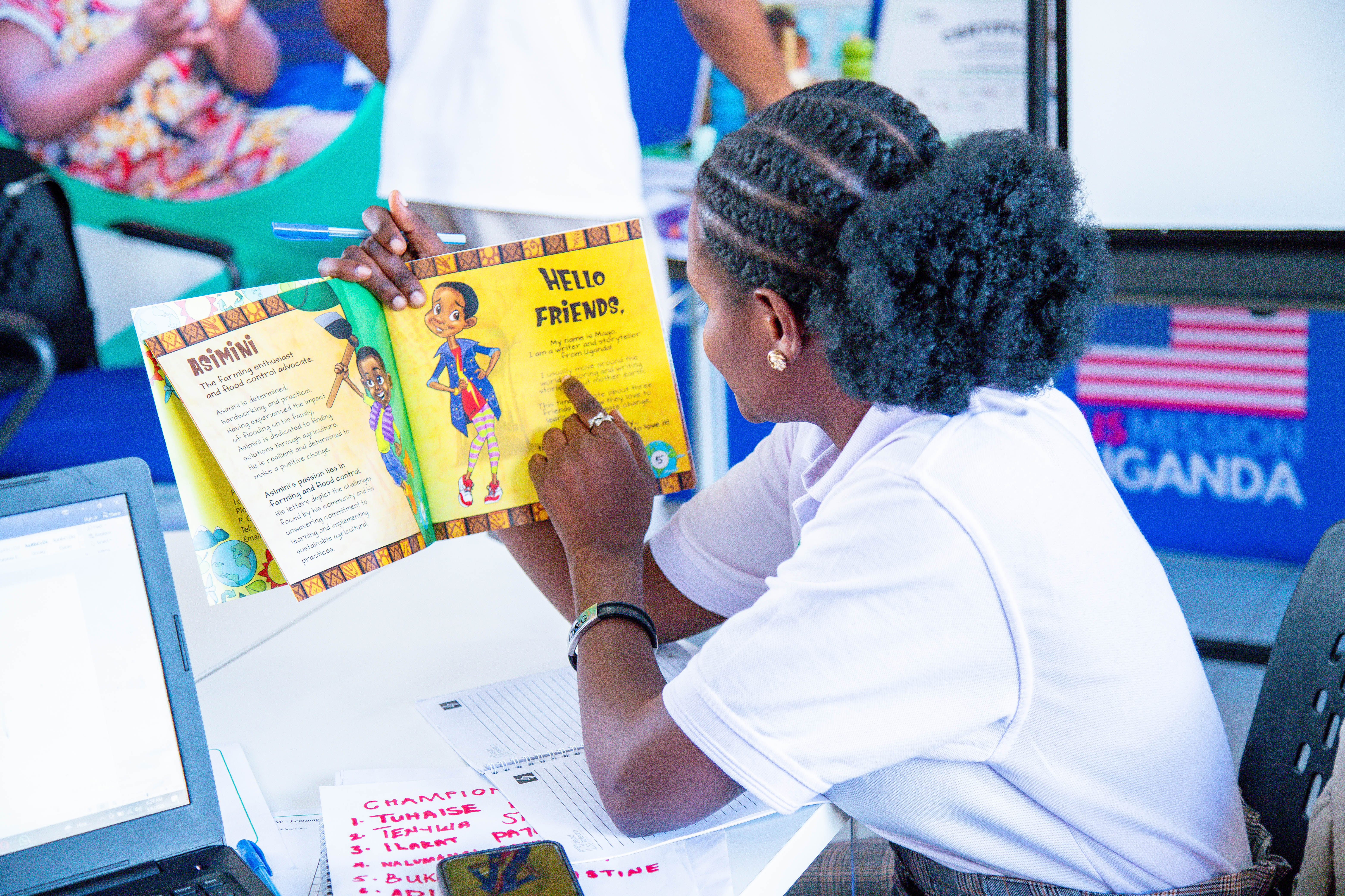 Woman pointing to a book to children surrounding her