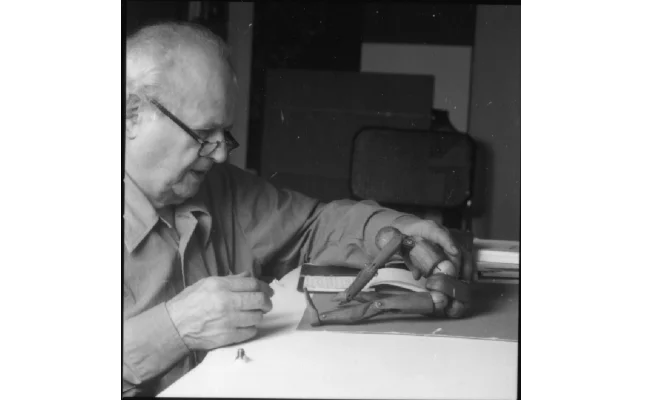 Moshe Feldenkrais working on doll