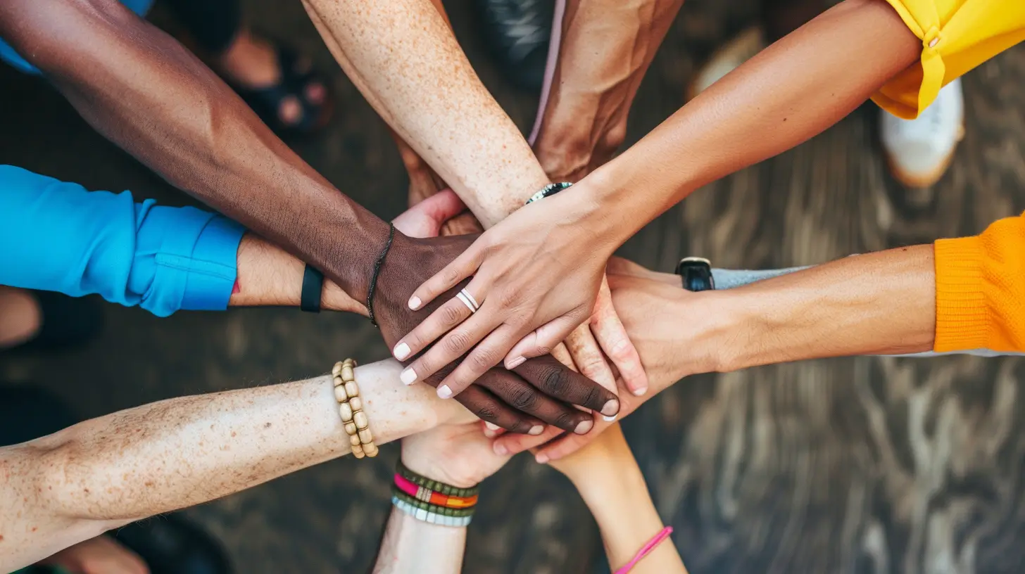 Diverse group of people holding hands in support