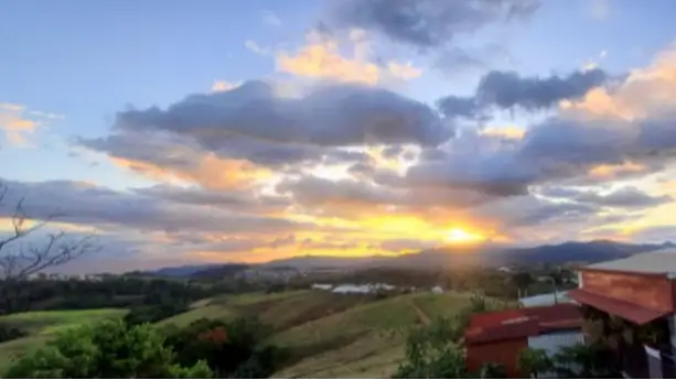 The sunset view from the deck of Lynda's home in Grecia.