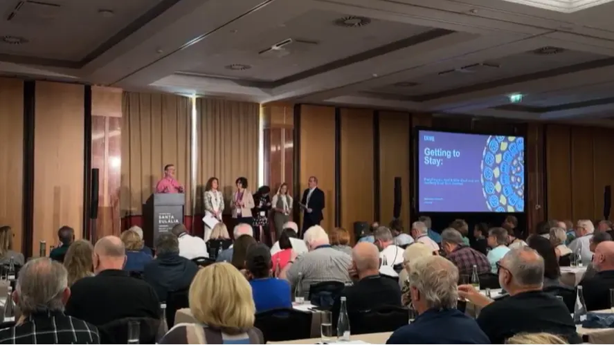 Attendees gather at an International Living conference to explore life overseas.