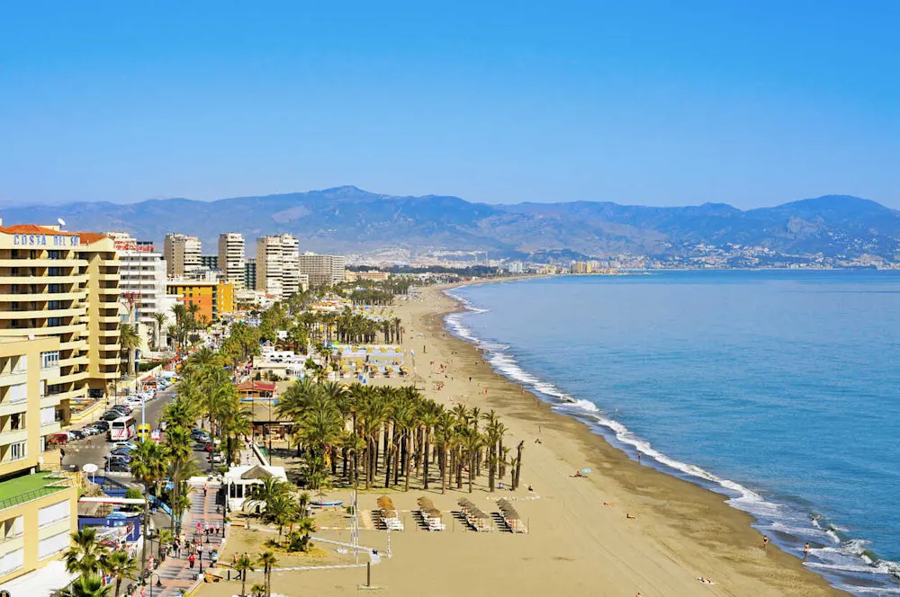 Beachfront cafés and warm breezes make Torremolinos a favorite for LGBTQ expats.