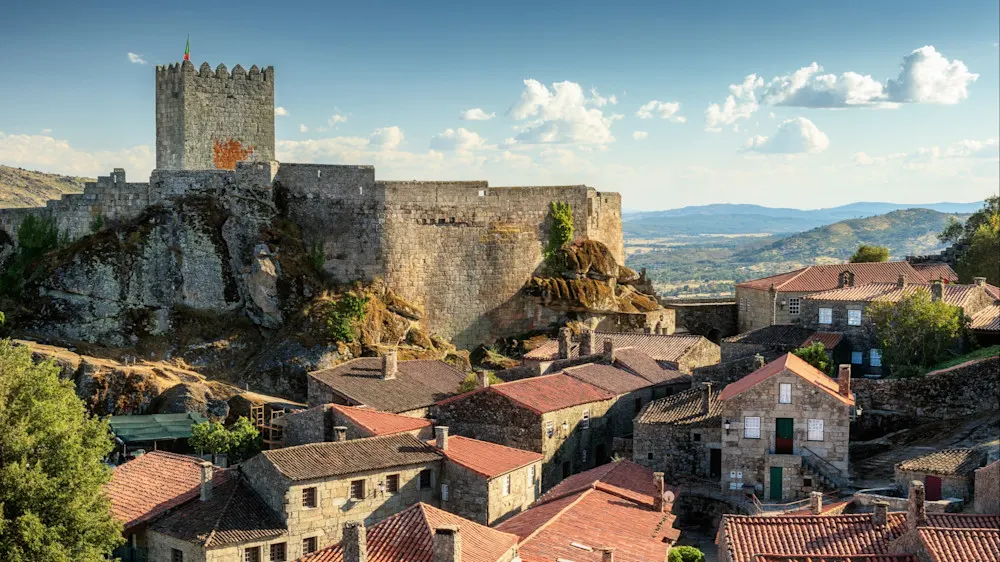 Stone homes, ancient sculptures, and a high-perched castle define this medieval jewel.