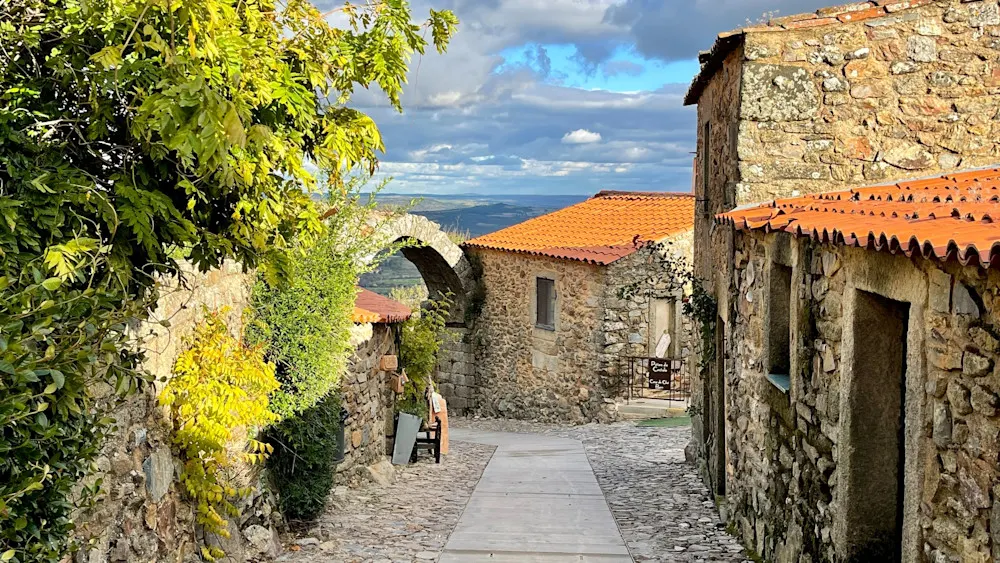 Stroll steep lanes, palace ruins, and look out to Spain from this walled hilltop gem.