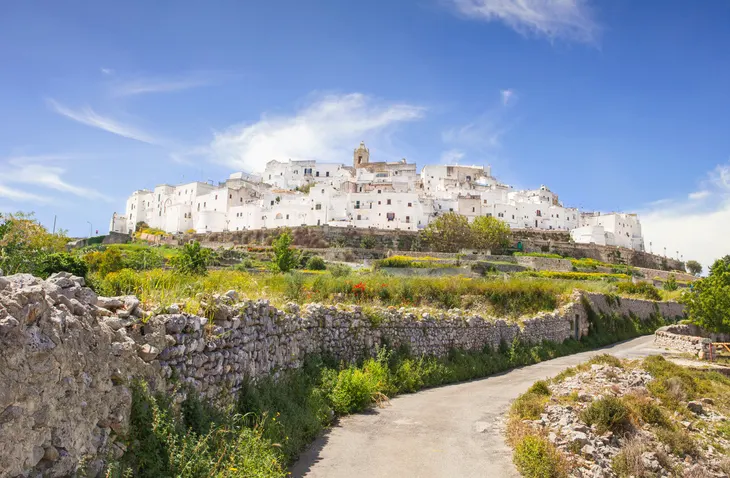 Exploring the charming whitewashed streets of Ostuni.