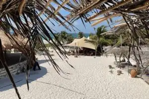 Complimentary membership at this Tulum beach club will include free shuttle rides from your condo.