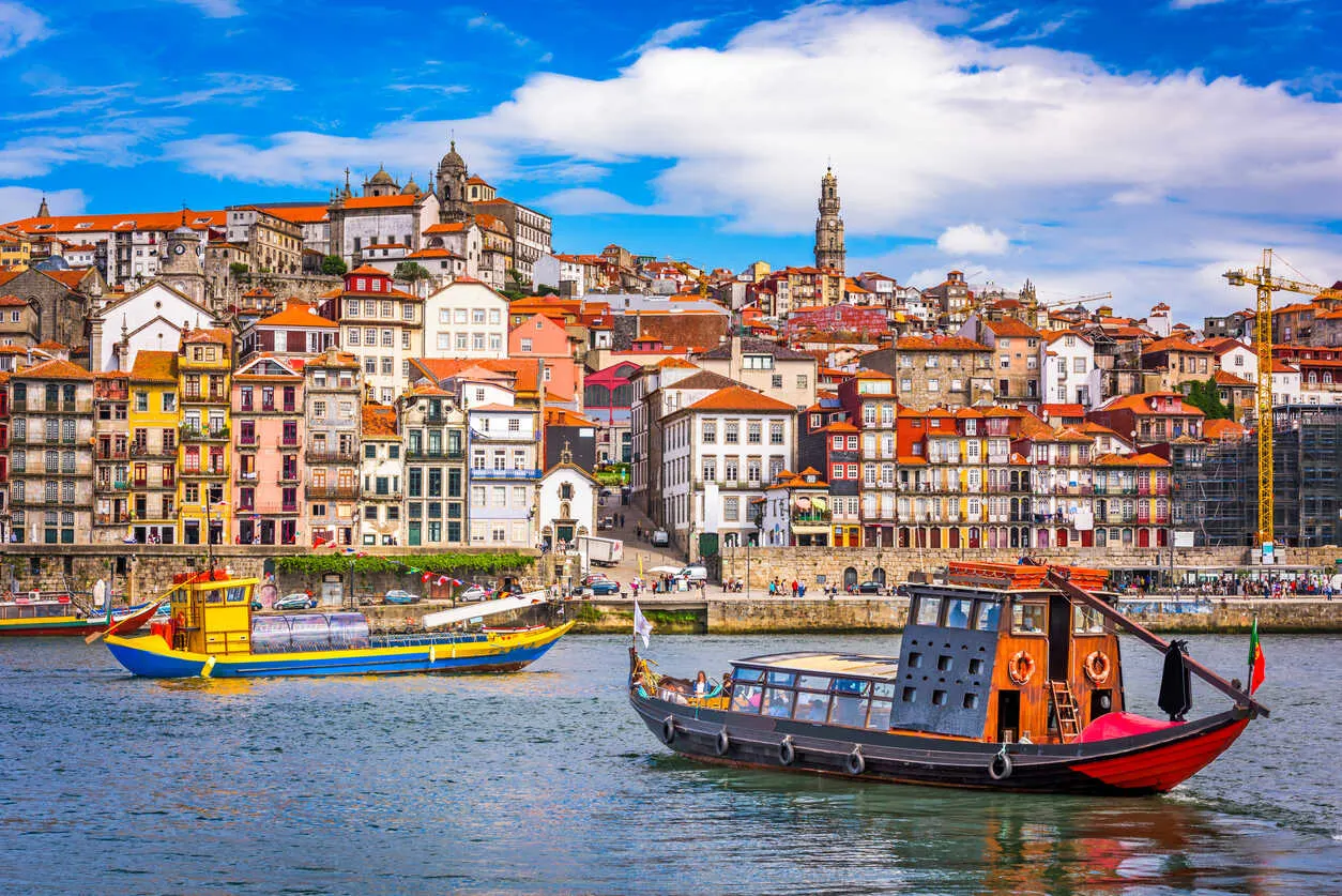 Colorful riverfront and port wine cellars define vibrant Porto.