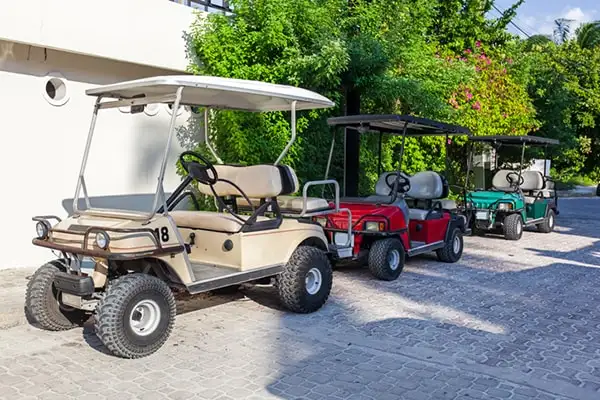 A golf cart is ideal for getting around this compact island. ©iStock/pashapixel