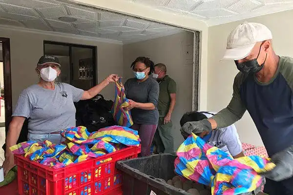 Cuenca Soup Kitchen volunteers packing food.