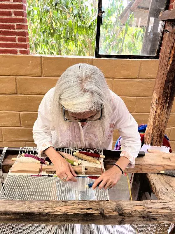 Donna weaving on a traditional loom in Teotitlan del Valle.