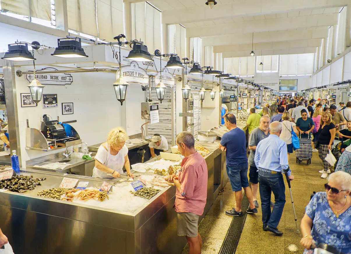 Daily life plays out at Mercado Central de Abastos, where fresh seafood fuels Cádiz cuisine.