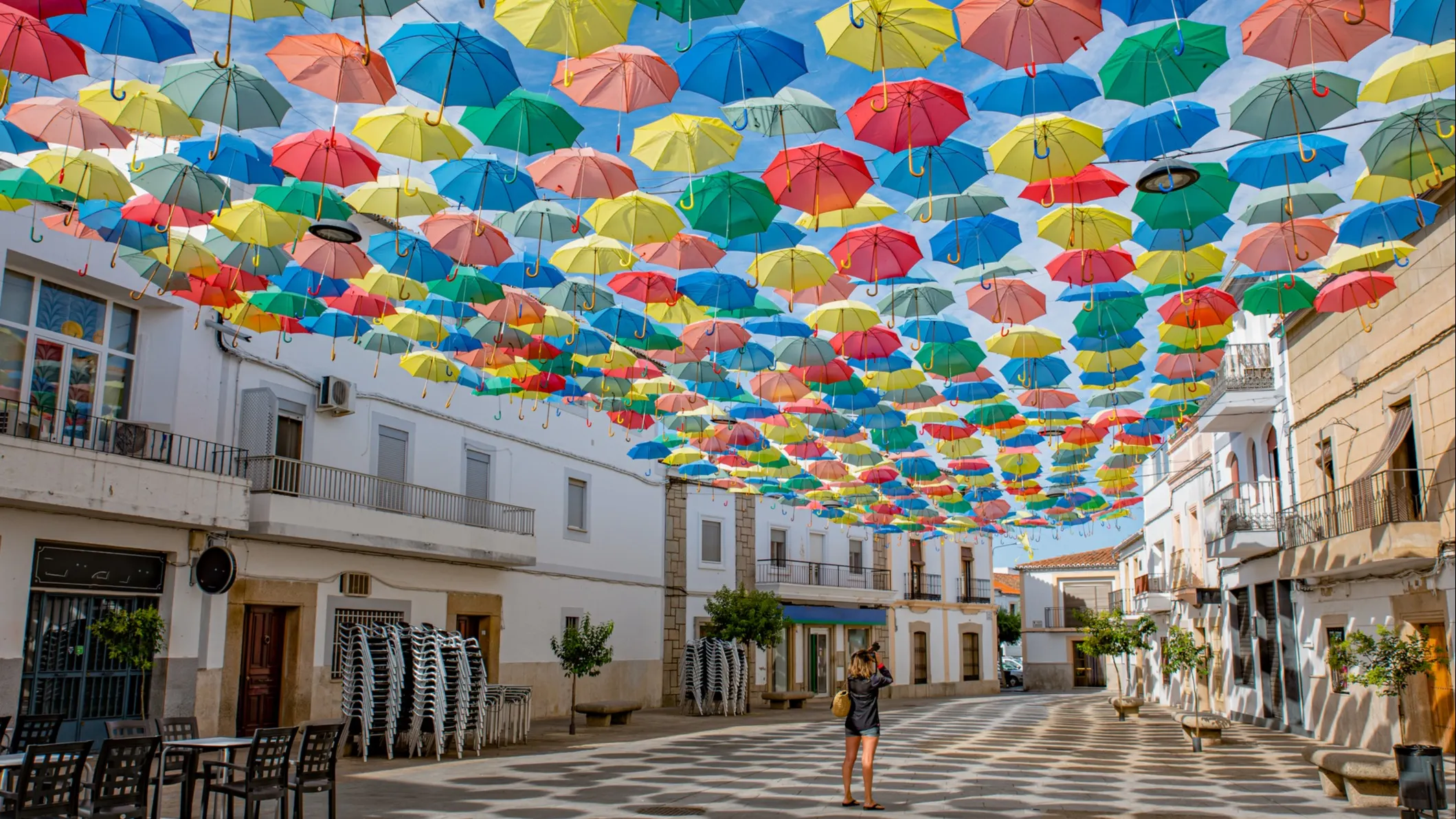 Known as the “Umbrella City,” with colorful streets and artistic flair.
