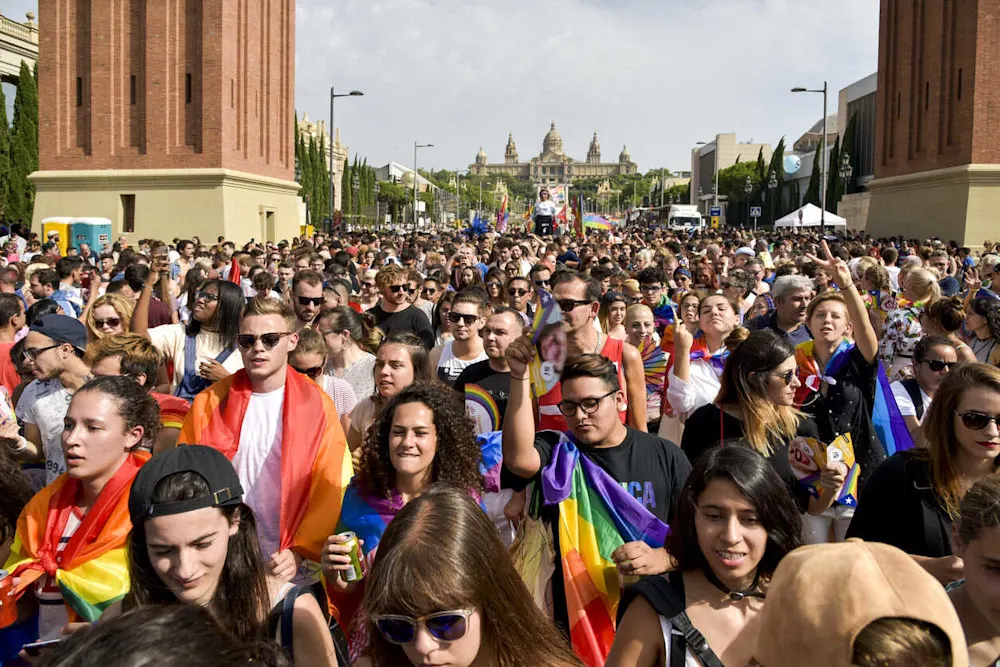 Marchers and rainbow flags fill the streets during Barcelona’s vibrant Pride celebration.