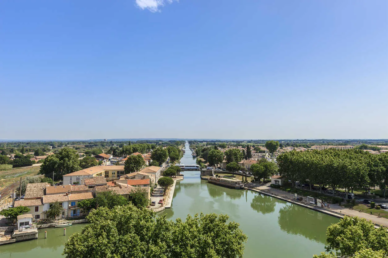 Medieval walls rise above the salt flats of Aigues-Mortes.