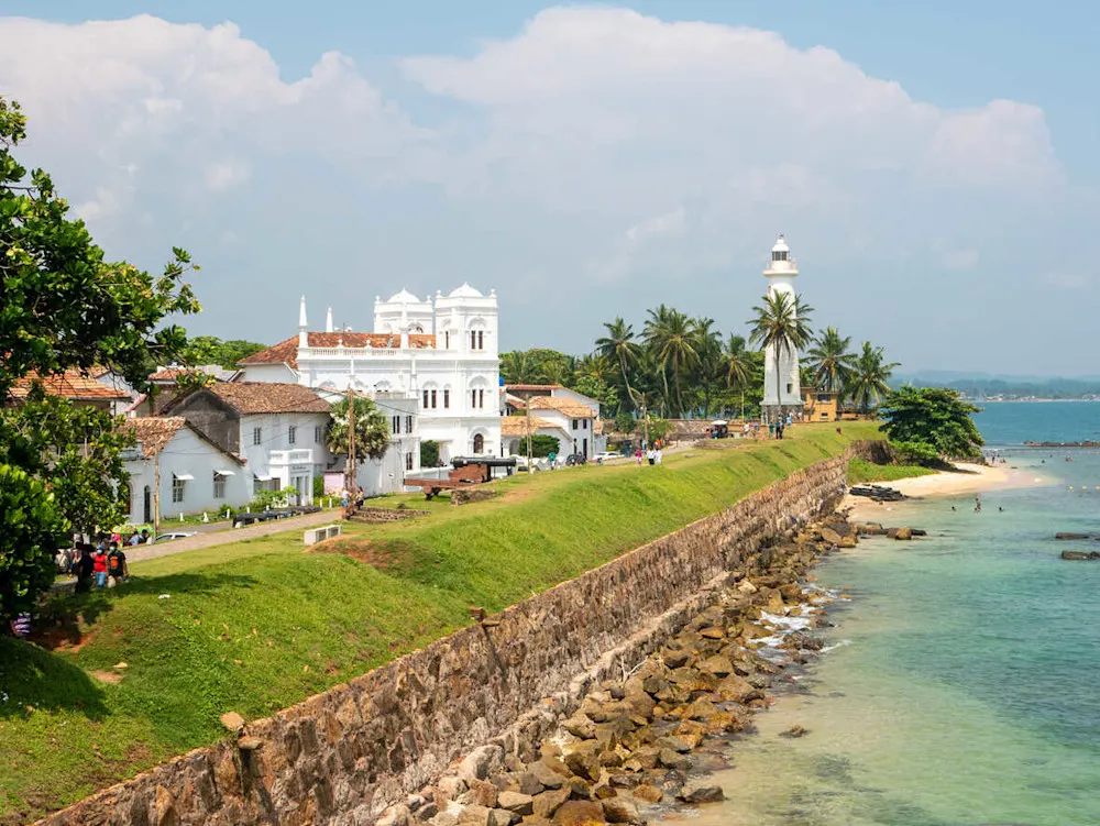 The white lighthouse and sea-washed walls of Galle Fort—one of our favorite evening strolls.