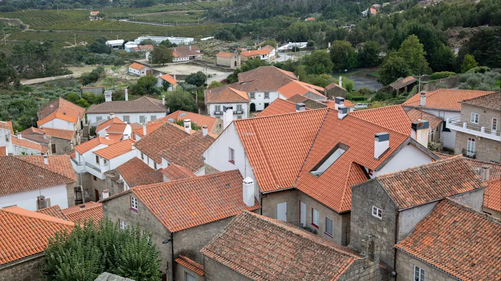 Stone houses, river beaches, and a castle backdrop create postcard-perfect charm.
