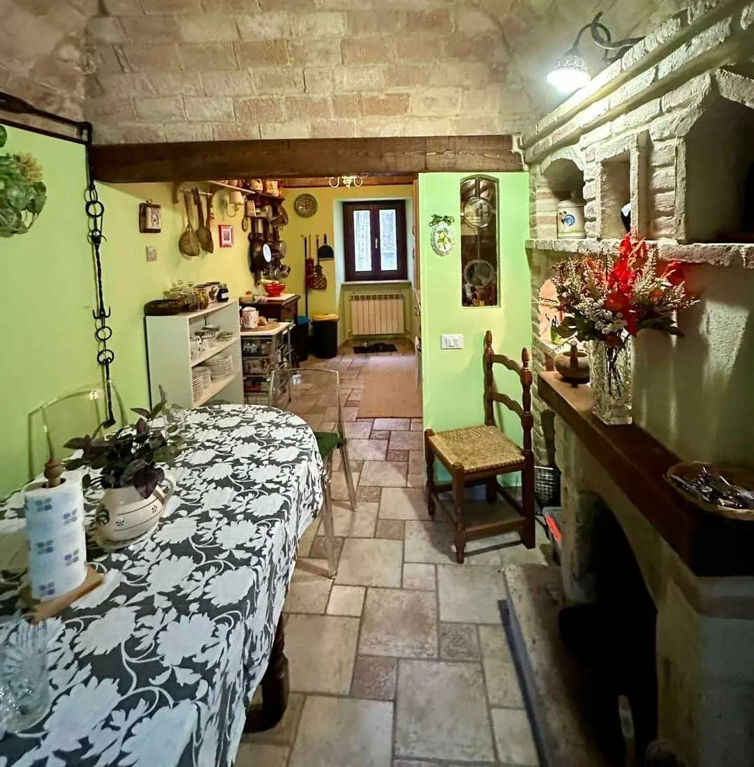 Their $130K Umbrian stone home includes vaulted ceilings, cozy guest cottages, and space to host family and friends.